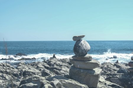 gray stone formation on beach photo