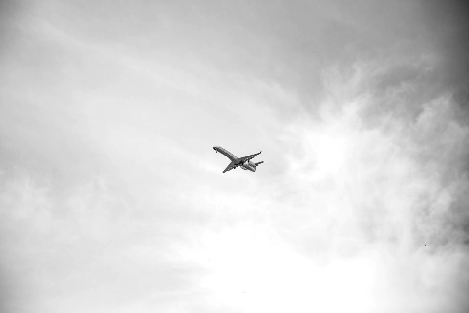 Grayscale photo of airplane