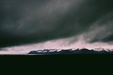 snow covered mountain during cloudy day photo