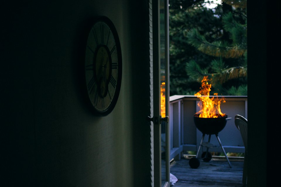 black charcoal grill on porch