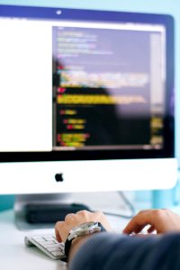 person in front of iMac