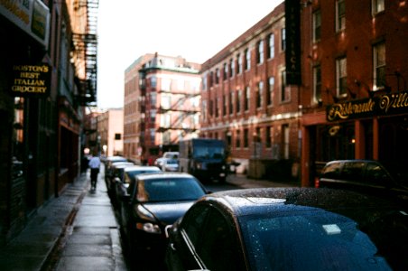 black cars lined up beside building