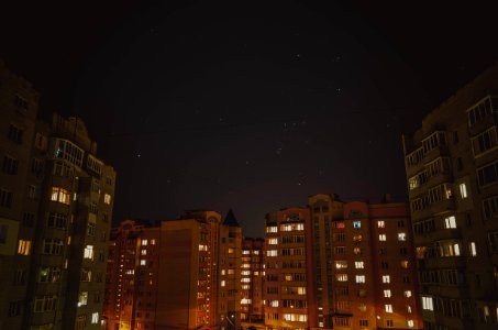 buildings under starry night sky photo