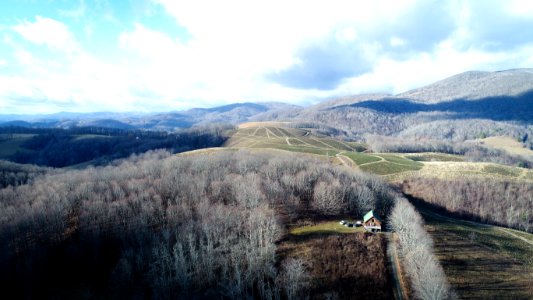 white and green fields under blue sky photography during daytime