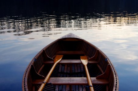 photo of oval brown rowboat photo