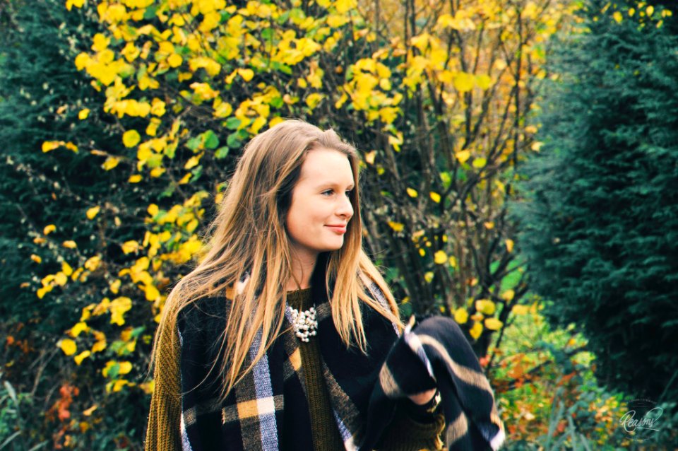 woman standing near green and yellow foliage tree