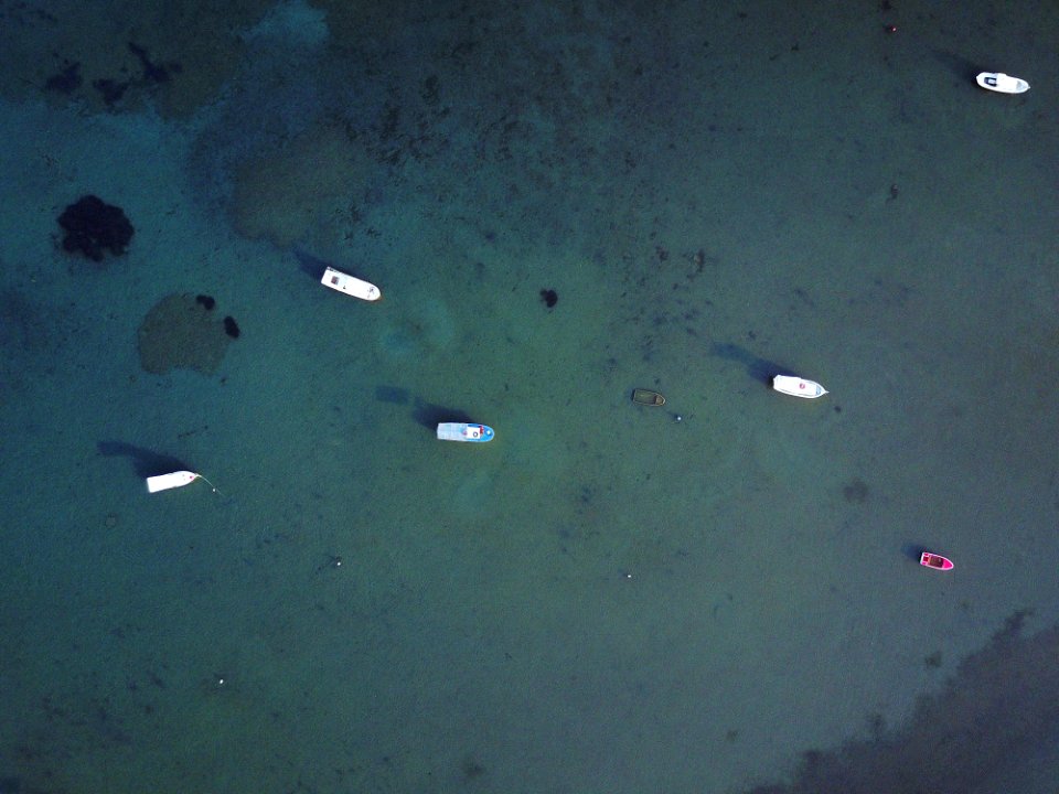 top view photography of six boats on body of water