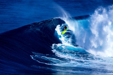 person doing surfing on wave photo