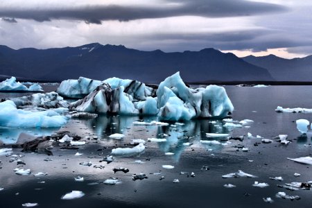 iceberg on body of water photo