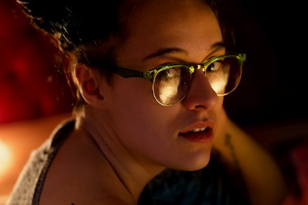 close up photography of woman wearing eyeglasses photo