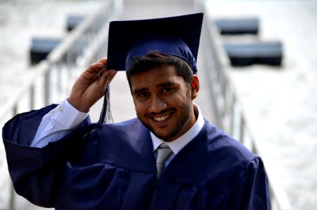man holding his graduation cap photo