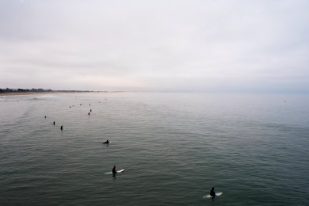 body of water under cloudy sky photo