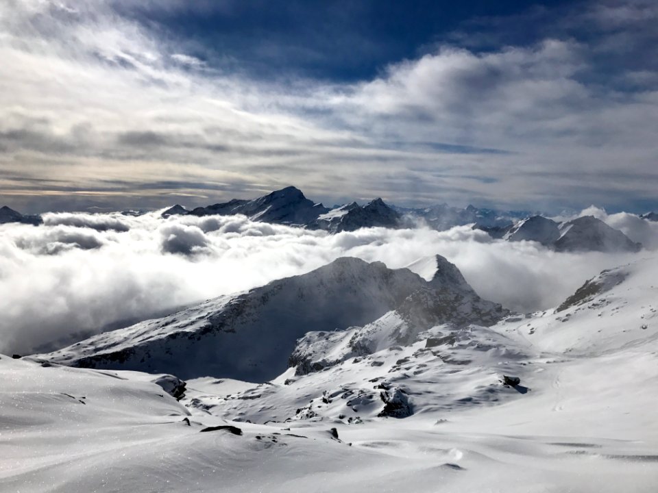 mountain range coated with snow