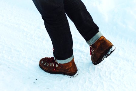 person standing on snowfield during daytime photo