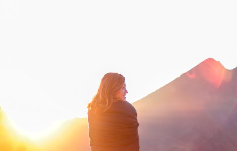 woman standing near mountain during daytime photo