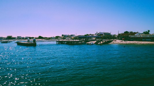 body of water near buildings at daytime photo