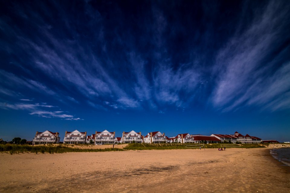 landscape photography of house under white clouds