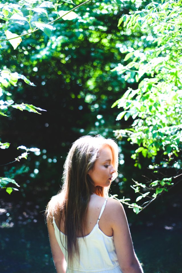 woman standing near tree during daytime photo