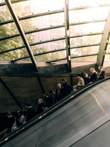 people using escalator during daytime photo