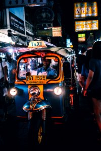 person riding on Taxi cub