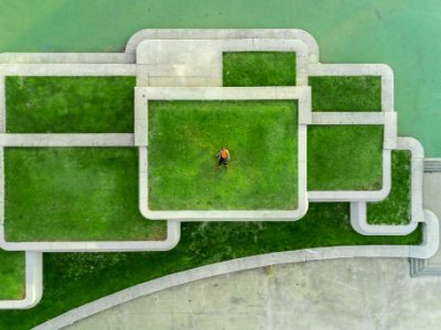 bird's eyeview photo of person lying on green grass photo