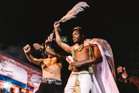 two topless men performing photo