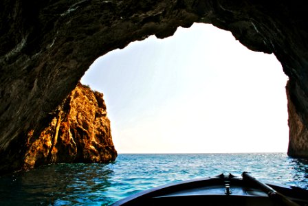 boat inside of water cave photo