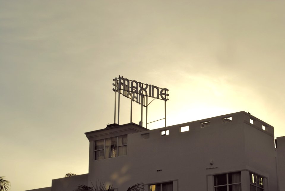 white concrete building under cloudy sky during daytime