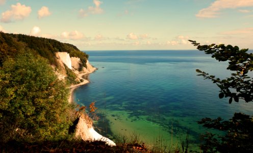 aerial view of green mountain and sea