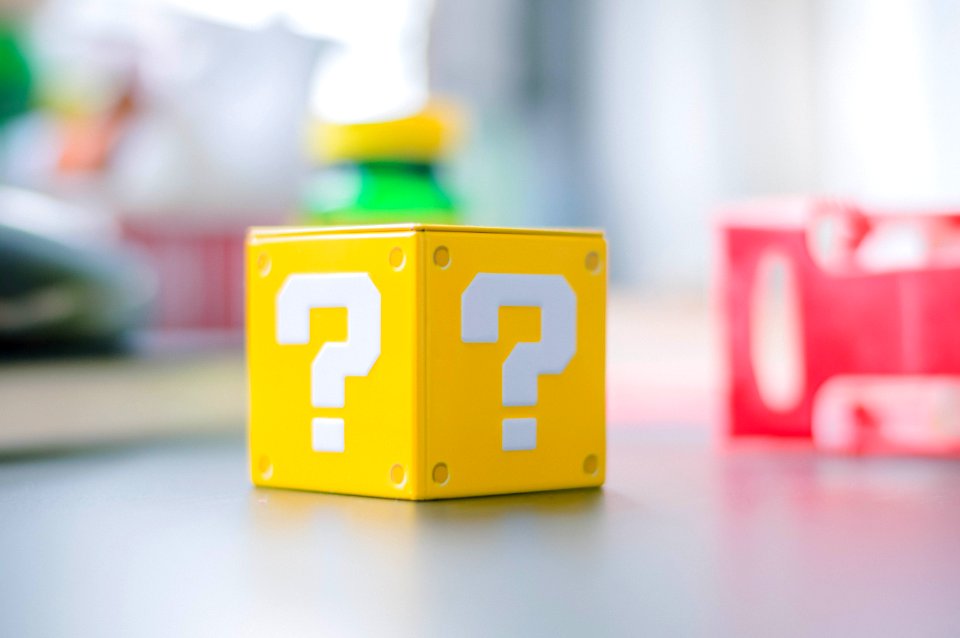 A blurred image of a yellow question mark box from Mario.