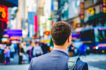 shallow focus photography of man in suit jacket's back photo