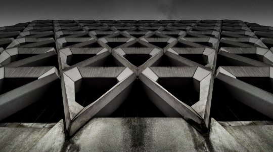 gray concrete building low-angle photography