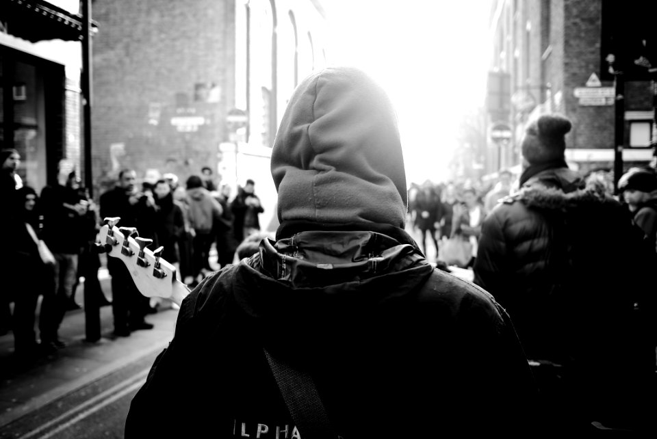 grayscale photography of person wearing hoodie