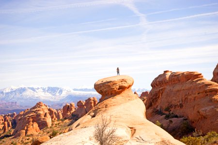 person on top of canyon photo