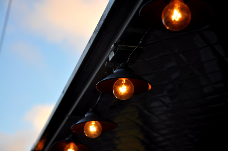 orange lighted bulbs under roof