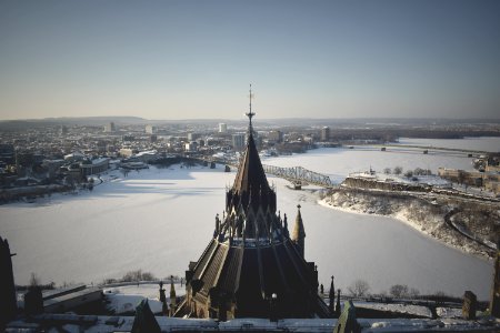 brown and black tower on snow covered ground during daytime photo