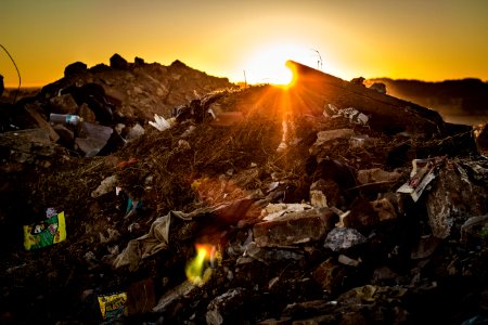 A picture of a local dump during sunset.