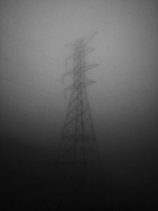 electric pylon covered by gray clouds photo