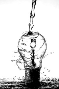 water dropping on light bulb photo