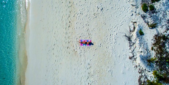 person sunbathing at the beach photo