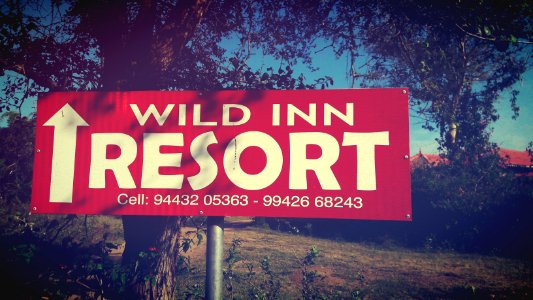 A sign pointing to where the Wild Inn Resort is located.