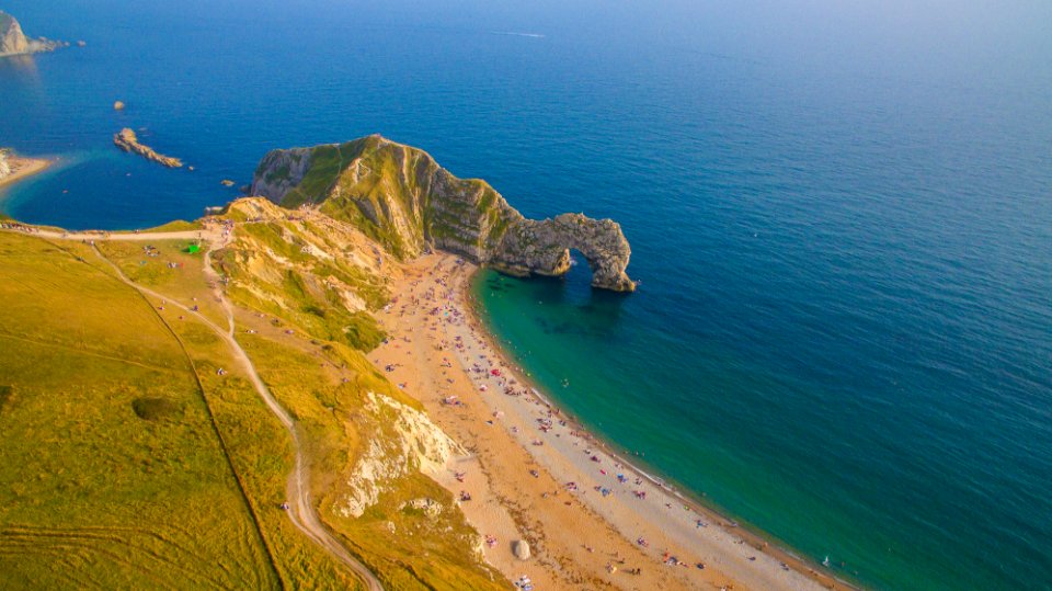 aerial photography of mountain near shore photo