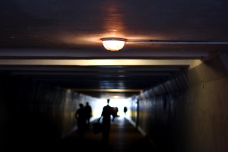 people walking inside tunnel photo