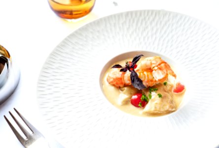 dish on plate beside fork