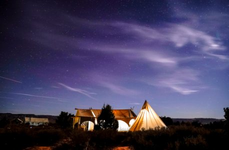 camping tent on field during nighttime photo