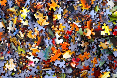 stack of jigsaw puzzle pieces photo
