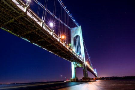 gray lighted suspension bridge during nighttime