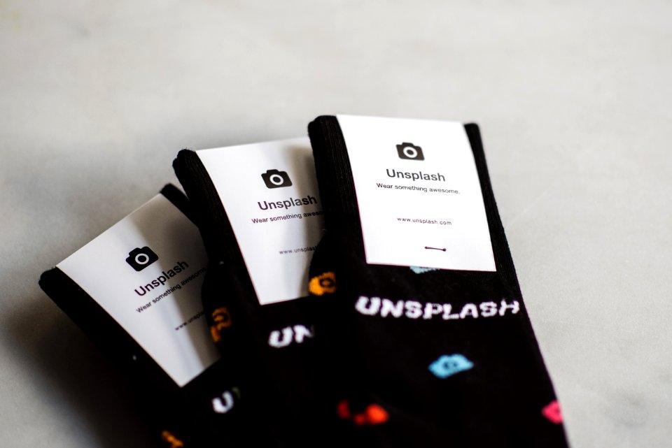 three pairs of black Unflash socks photo