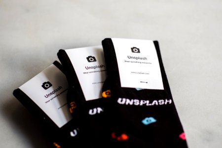 three pairs of black Unflash socks