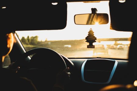 person driving car during daytime